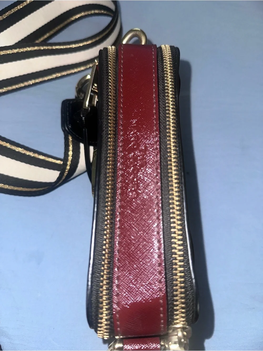 Marc Jacob’s Black and Red Crossbody Camera Bag with Gold Hardware